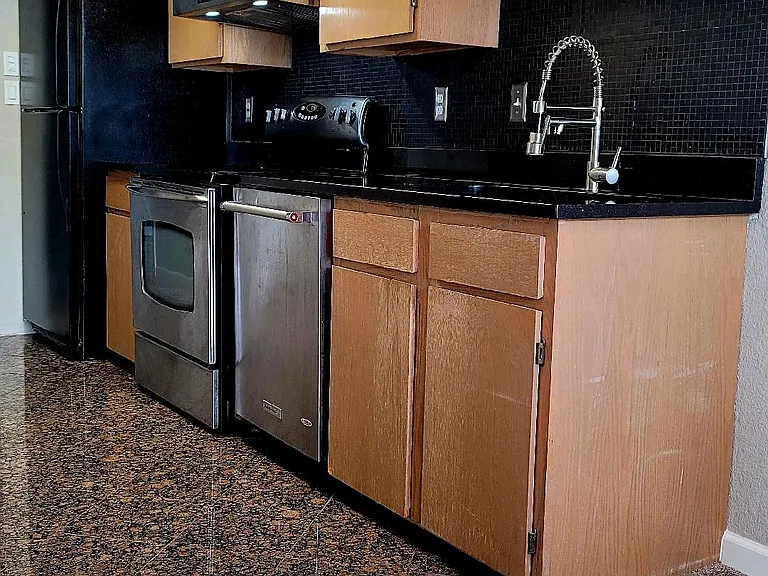 Dining Area Leading to Granite Floor in Kitchen