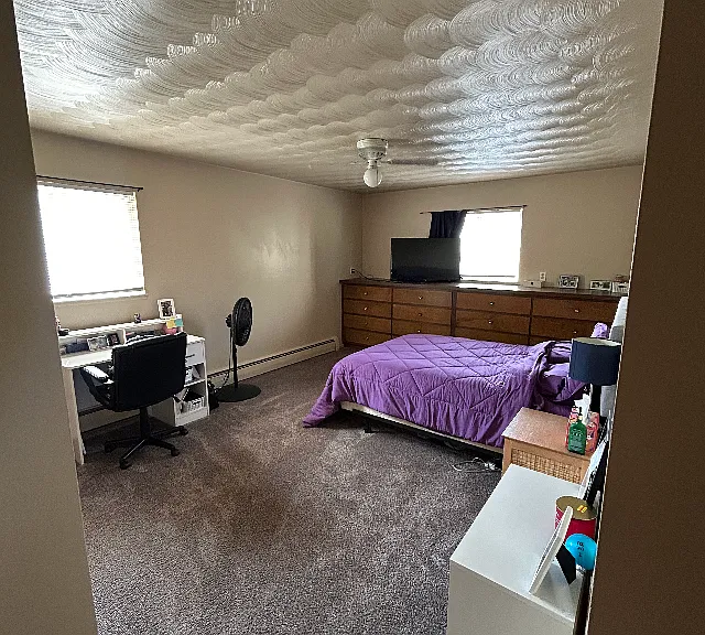 Bedroom standing at room entrance, showing built in dressers