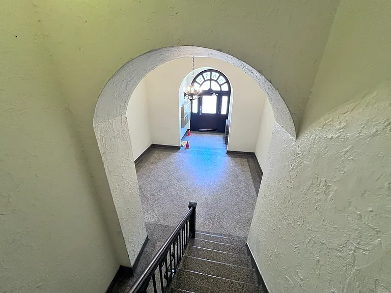 The lobby is very welcoming and well-lit. There is a secondary side entrance, not pictured, that conveniently lets out to the residential side street - where you will find ample parking.