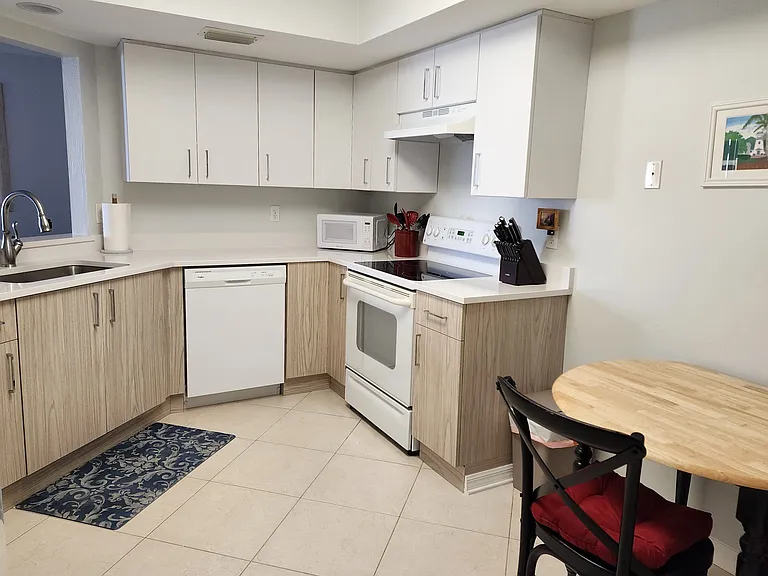 Kitchen with drop-leaf breakfast table and seating for 2.