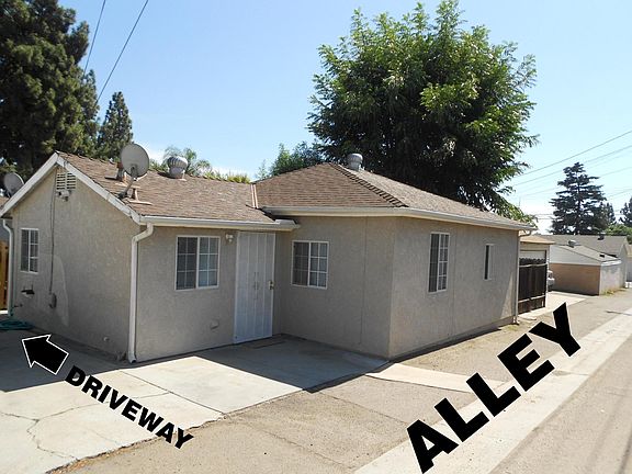 This SMALL GUEST HOUSE (750 sq. ft.) is located on an ALLEY behind the front house.