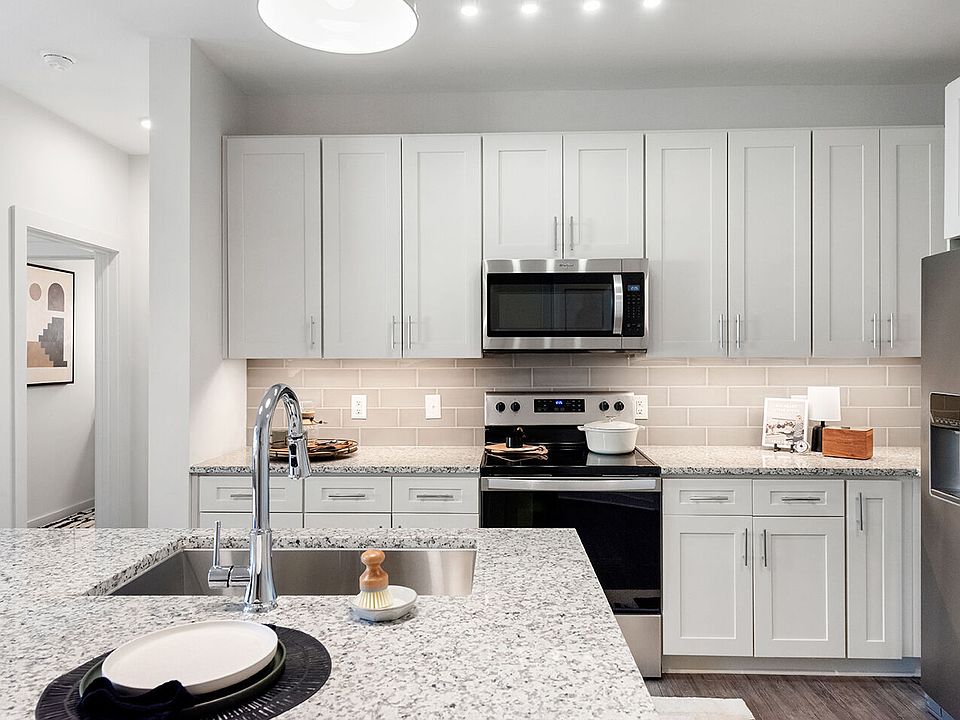 Custom Cabinetry with Under-Cabinet Lighting, Designer Hardware, and Tile Backsplashes