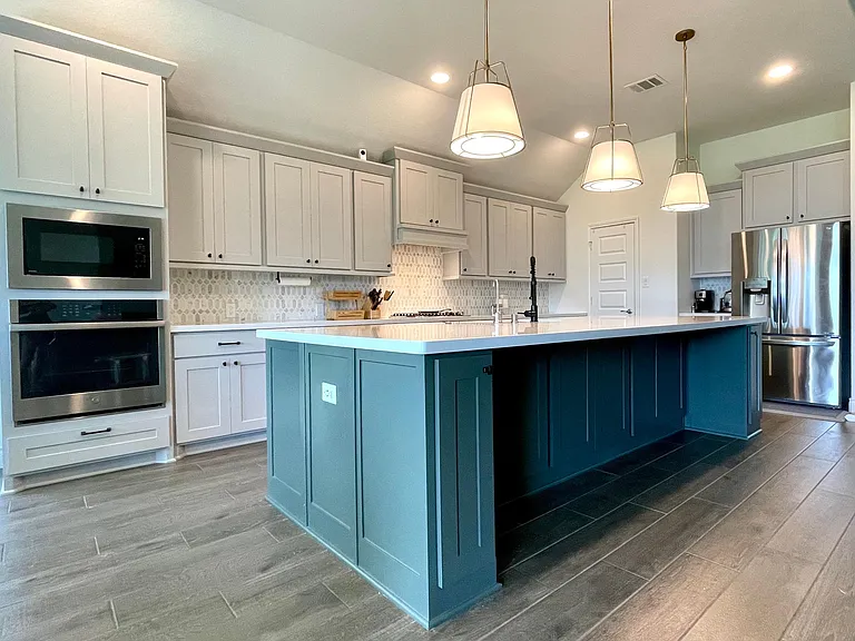 Updated kitchen island pendants and newly painted island cabinets