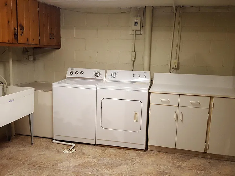 Laundry room and storage in basement