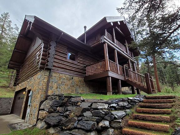 Custom log steps and tiered landscaping