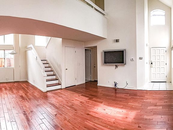 Living room/dining area (to the left of staircase)