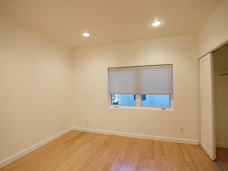 Front Bedroom Windows with Solar Shades and Closet
