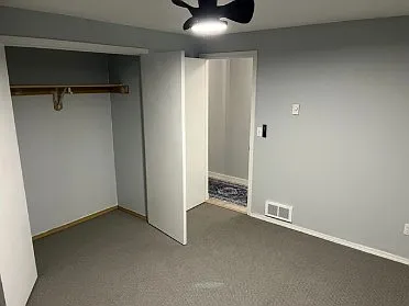 1st bedroom w/closet and celing fan