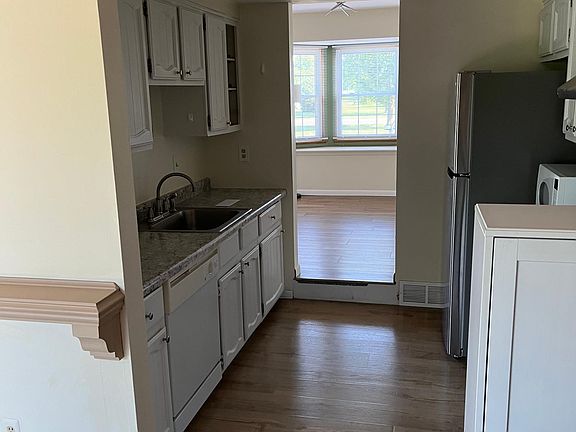 KITCHEN W VIEW FROM FAMILY ROOM AND LIVING ROOM BEYOND