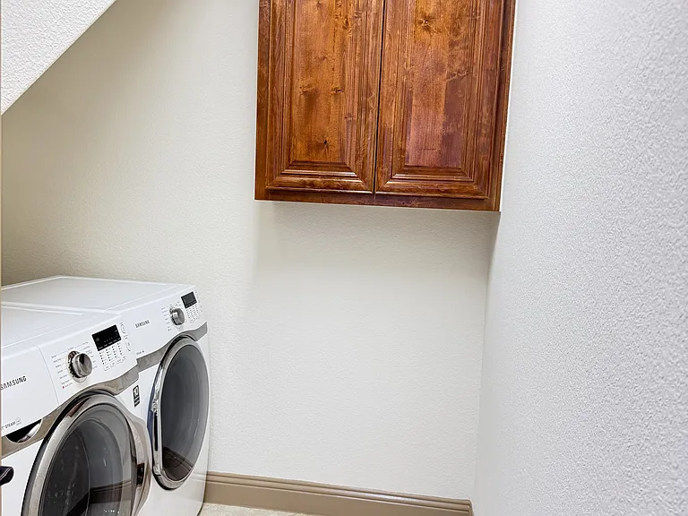 utility room with full size washer and dryer