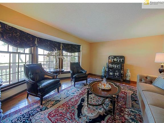 ENTER INTO YOUR CHARMING FRONT SITTING ROOM WITH HARDWOOD FLOORS