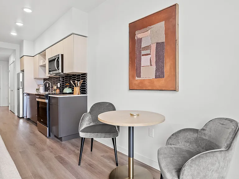 Sleek and functional: Discover our modern kitchens, designed with ample space for a cozy table for two, perfect for intimate meals and culinary creativity. ____