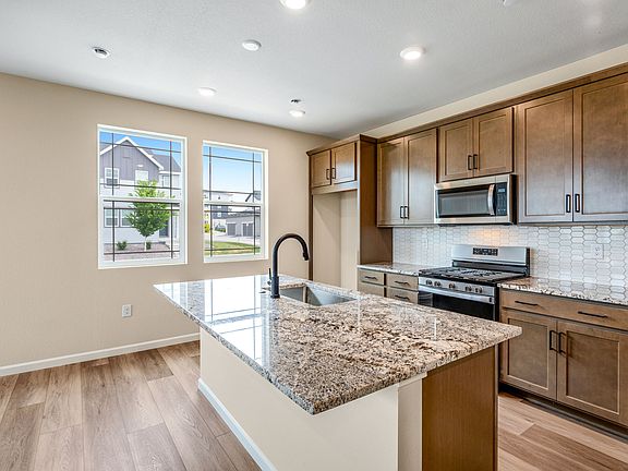 Explore culinary endeavors in the chef s kitchen, featuring stunning quartz counters