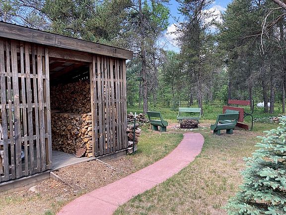 wood shed and fire pit area