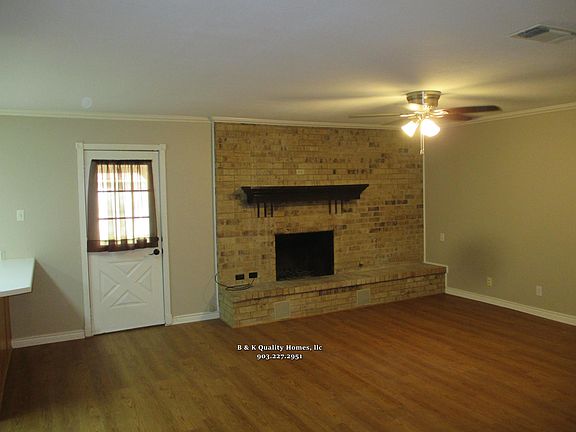 Family room with door that leads to covered back porch