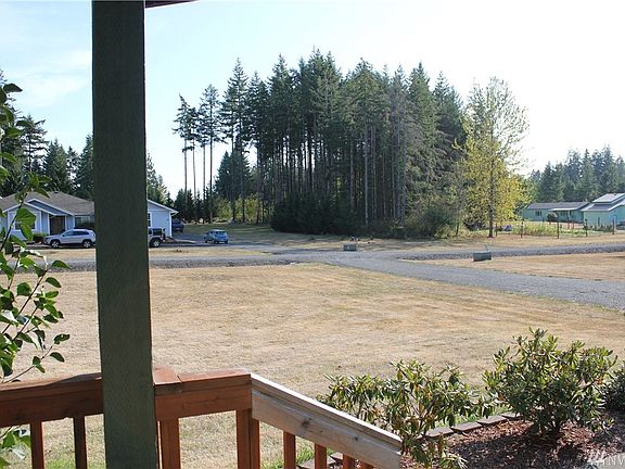View from the front deck, home is set back from the road, private neighborhood with nice homes