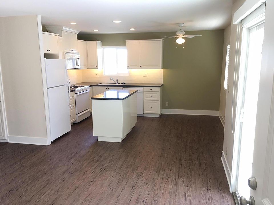 Open kitchen w/ granite, beautiful cabinets, LED lts. o/ ISLAND
