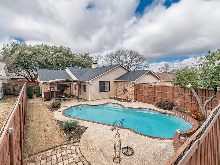 Family friendly swimming pool in private backyard