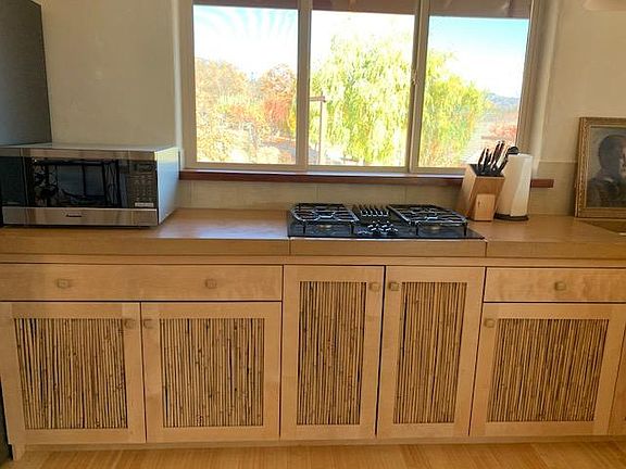 Kitchen overlooking organic orchard