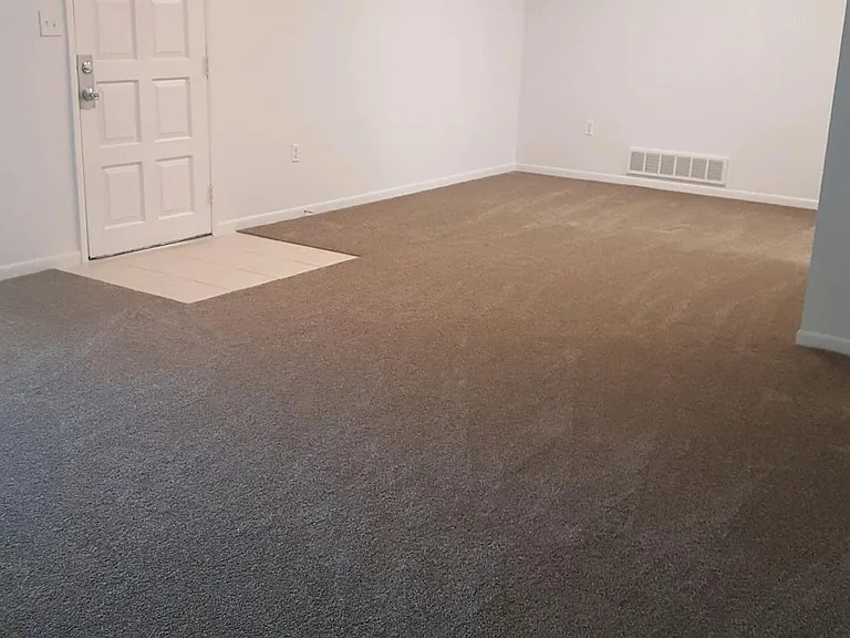 Living room and dining to the back