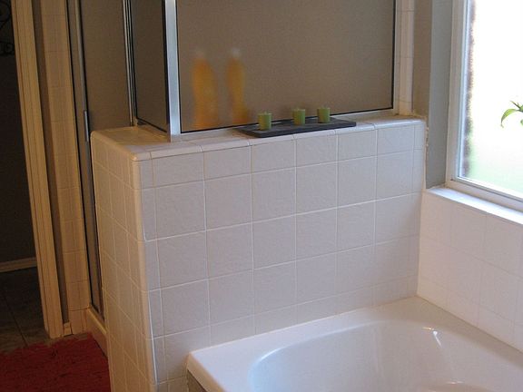 Separate jacuzzi tub and shower in master bath