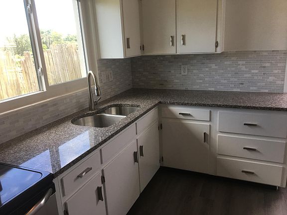 GRANITE TOPS AND CERAMIC BACKSPLASH, LOTS OF CABINETES