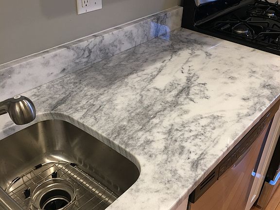 Granite countertop in kitchen with custom cabinets