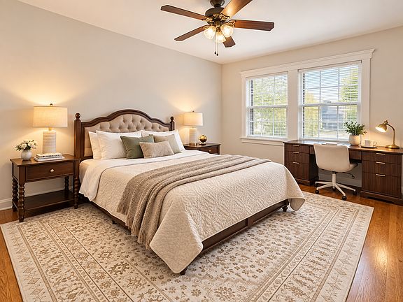 Bright, comfortable bedroom featuring a queen-size memory foam mattress, TV with Netflix Premium, executive desk for remote work, and ultra-fast 1 Gbps internet_thoughtfully designed for restful nights, productive days, and extended stays.