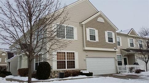 Immaculate sun-filled, end-unit townhome in great Farmington location with 2 story living room, 2-car garage.