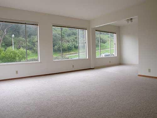 Living room and dining area, with park view