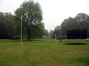 A view of the deep beautiful backyard with woodland and partial Lake Huron views. A great yard for c
