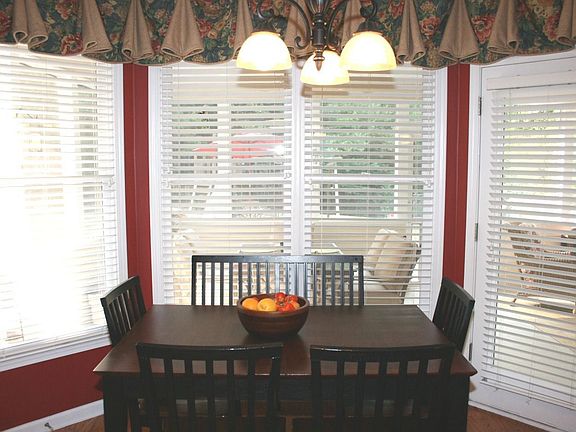 Breakfast nook in kitchen with hardwoods.