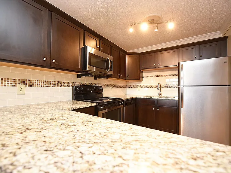 Explore this sleek kitchen design, where style meets functionality.