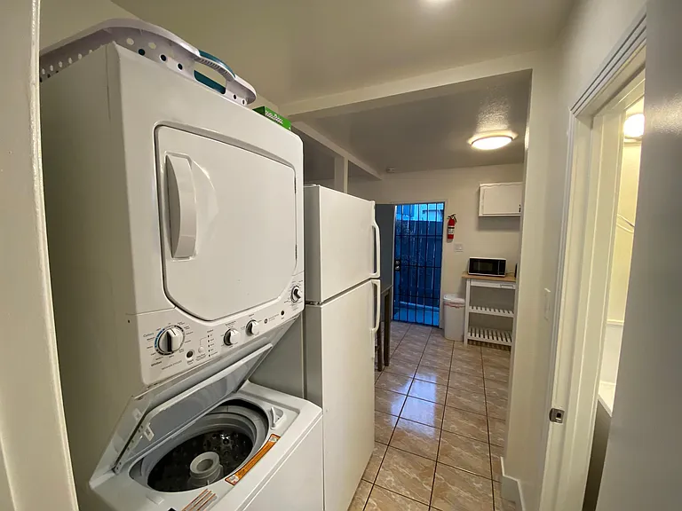2 Bedroom: Laundry machines and full size refrigerator