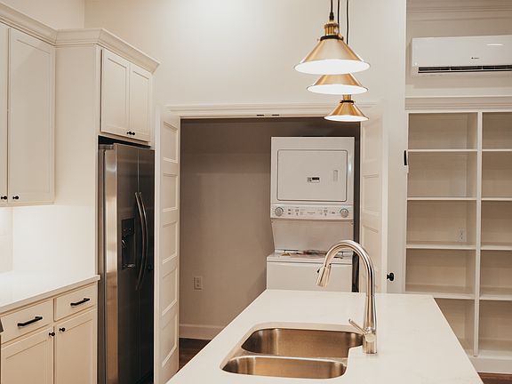 Laundry closet with stack washer and dryer