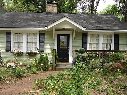 The front of the house has recently been landscaped. 