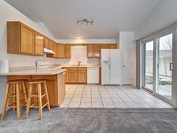 Kitchen with sliding glass door to backyard