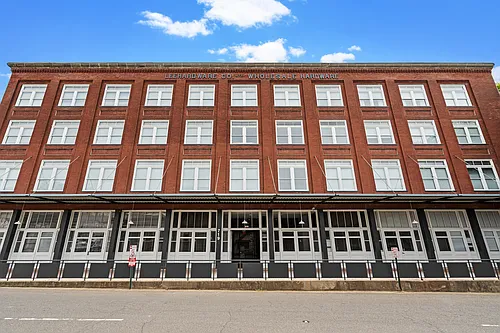 United Jewelers and Lee Hardware Apartments Photo 1