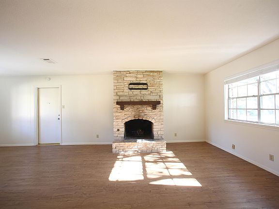 Fireplace in the Living Room Door to the Garage