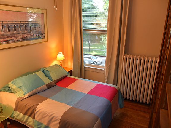 large east bedroom 2nd floor with built in shelving