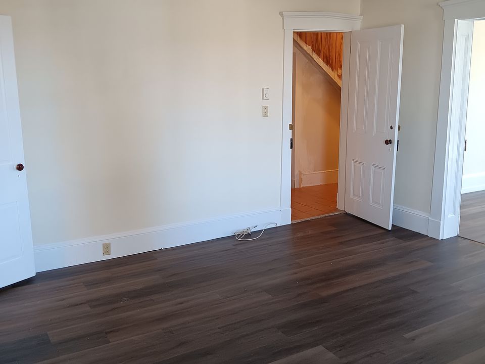 Living area, 15' x 15'. Doorway going to the bathroom