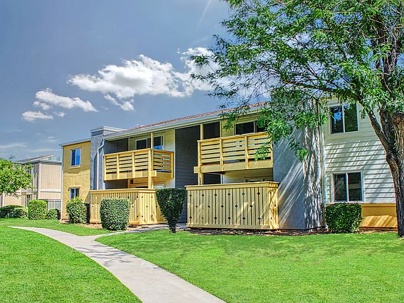 Inviting green spaces with private patios and balconies.