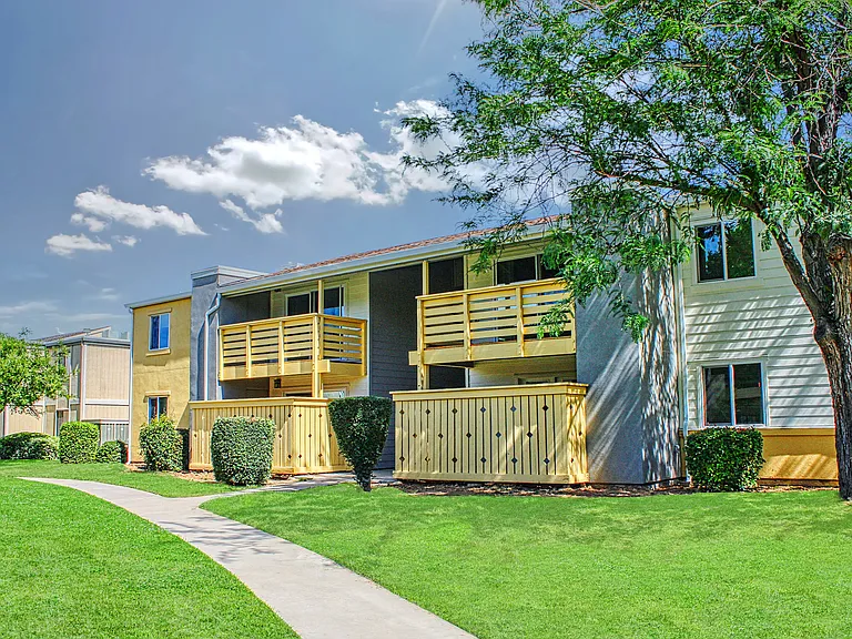 Inviting green spaces with private patios and balconies.