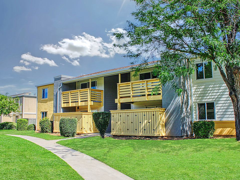Inviting green spaces with private patios and balconies.