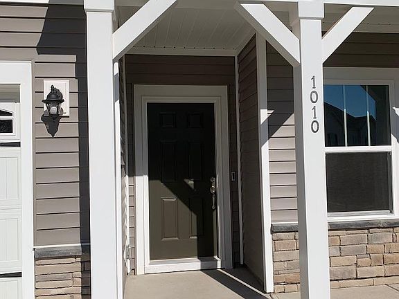 Front porch with overhang and Nest doorbell