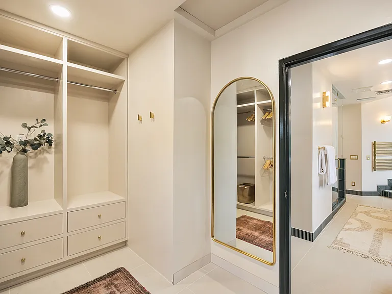 Spacious walk-in closet with custom shelving and ample storage space for all your belongings.