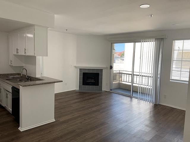 Spacious living room with working fireplace.