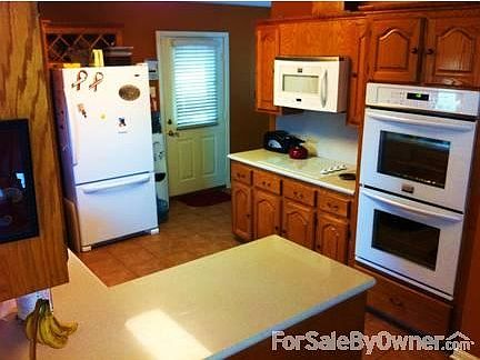 KITCHEN
						:
						New tile floor and counter tops. New appliances, refrigerator is included.