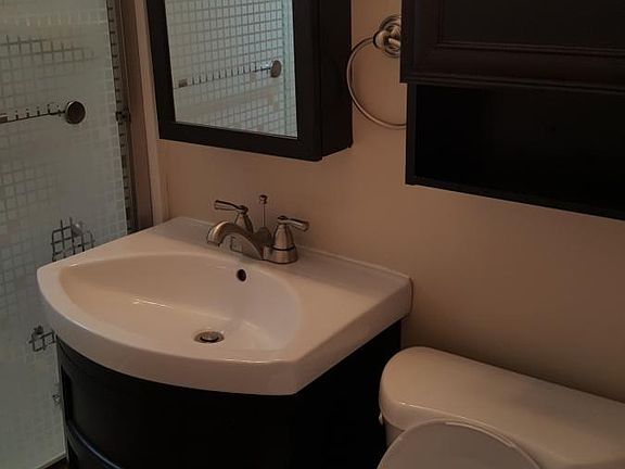Bathroom with storage over toilet