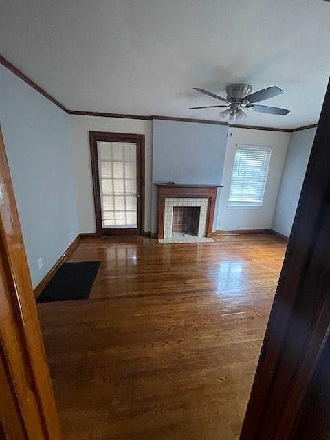 Living room with fire place and mantle